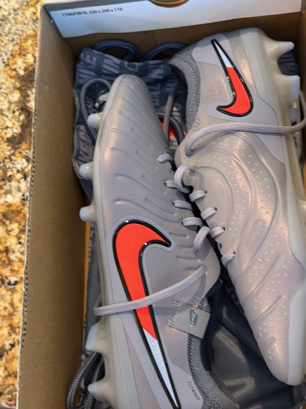 Nike Gray Soccer Cleats with Red Accents